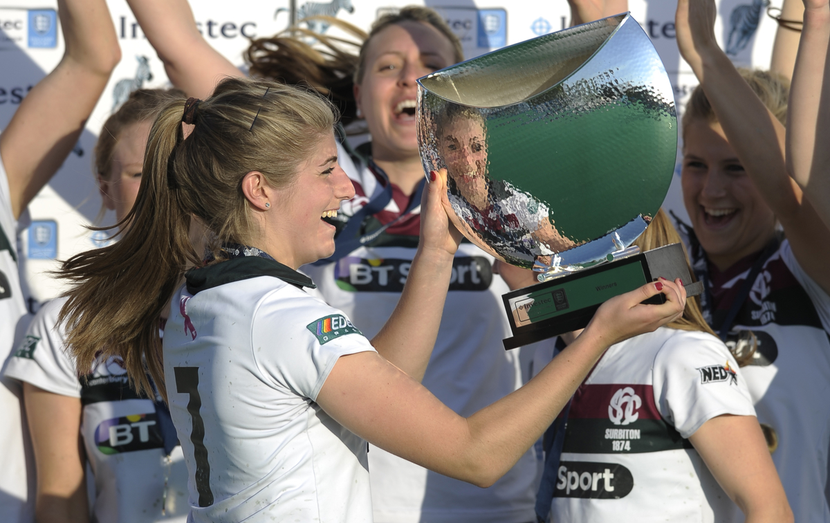 Surbiton's captain Sarah Haycroft with her team as they lift the Investec Women's Championship trophy - credit Ady Kerry.jpg